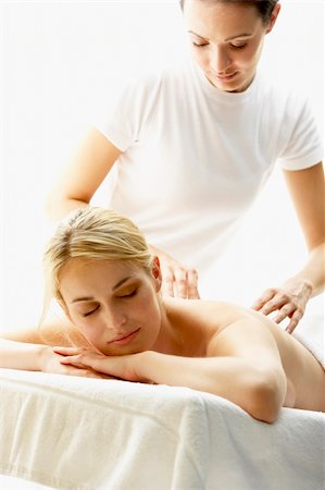 simsearch:400-05686719,k - Young Woman Enjoying Massage Fotografie stock - Microstock e Abbonamento, Codice: 400-05686686