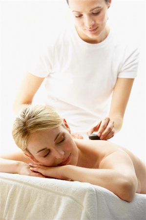 simsearch:400-05686717,k - Young Woman Enjoying Hot Stone Treatment Stock Photo - Budget Royalty-Free & Subscription, Code: 400-05686687