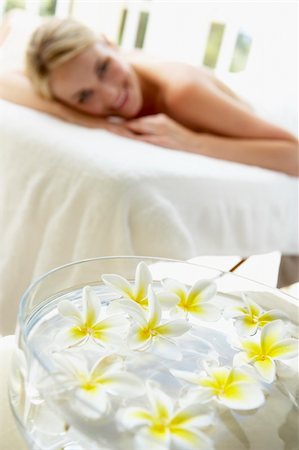 simsearch:400-05686717,k - Woman On Massage Table With Flowers In Foreground Stock Photo - Budget Royalty-Free & Subscription, Code: 400-05686697