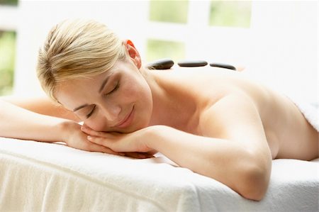 simsearch:400-05686717,k - Young Woman Enjoying Hot Stone Treatment Stock Photo - Budget Royalty-Free & Subscription, Code: 400-05686690