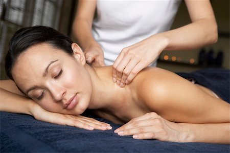 simsearch:400-05686719,k - Young Woman Enjoying Massage Fotografie stock - Microstock e Abbonamento, Codice: 400-05686720