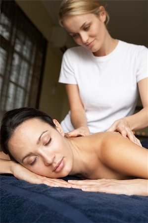 simsearch:400-05686719,k - Young Woman Enjoying Massage Fotografie stock - Microstock e Abbonamento, Codice: 400-05686722