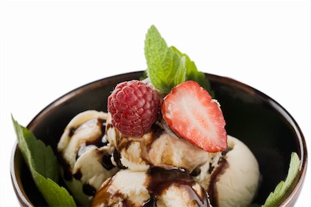 strawberry vanilla chocolate ice cream - Dessert. Ice cream watered chocolate  with strawberries and mint leaves Stock Photo - Budget Royalty-Free & Subscription, Code: 400-05680180