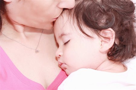 simsearch:400-05320841,k - delighted young mother taking care of her adorable baby at home Stock Photo - Budget Royalty-Free & Subscription, Code: 400-05680221