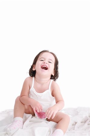 laughing little girl on her bed Stock Photo - Budget Royalty-Free & Subscription, Code: 400-05680238