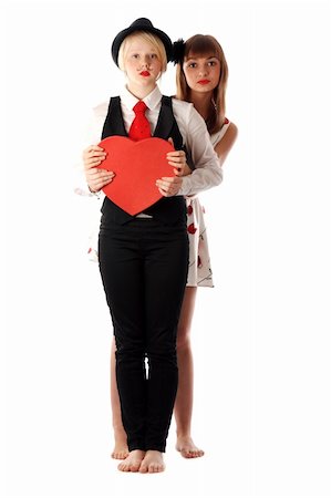 Two girls with red cardboard heart on white background Stock Photo - Budget Royalty-Free & Subscription, Code: 400-05680636