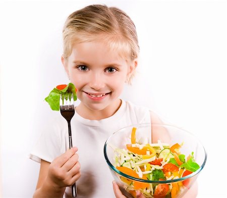 poco appetitoso - Little girl eating vegetable salad - healthy food concept Photographie de stock - Aubaine LD & Abonnement, Code: 400-05680703