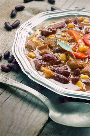 steaming soup - Chili con carne plate. Mexican traditional dish in rustic setting Stock Photo - Budget Royalty-Free & Subscription, Code: 400-05681858