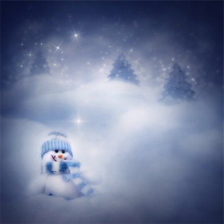 simsearch:400-08407579,k - Christmas blue background. Snowman toy on the bokeh winter background in the snow and magical forest with Christmas shiny trees. Photographie de stock - Aubaine LD & Abonnement, Code: 400-05681859