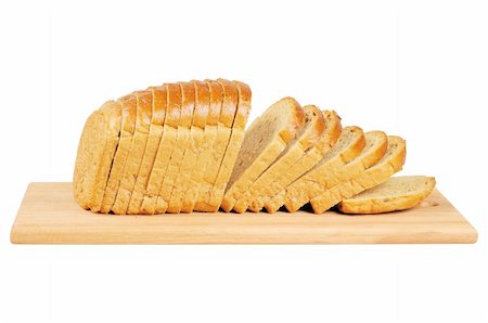 sliced white bread - Sliced bread on wooden board. Isolated on white. Stock Photo - Budget Royalty-Free & Subscription, Code: 400-05682222