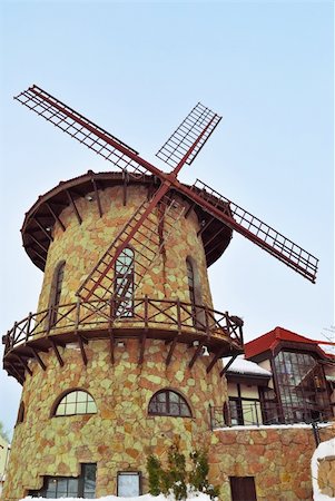 fräsen - Stylish stone brick windmill against the blue sky. Stockbilder - Microstock & Abonnement, Bildnummer: 400-05682280