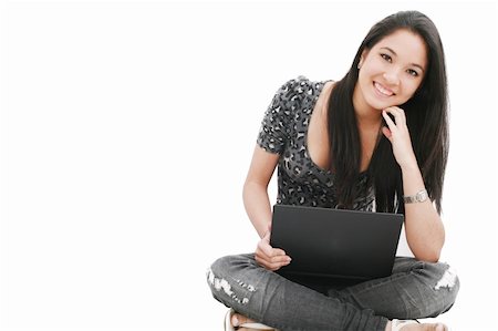 attractive young female sitting on the floor using laptop Stock Photo - Budget Royalty-Free & Subscription, Code: 400-05683026