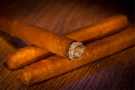 Typical havana cigars on wooden background Stock Photo - Budget Royalty-Free & Subscription, Code: 400-05683081