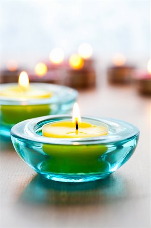 Close-up of yellow candles in blue glass holders Stock Photo - Budget Royalty-Free & Subscription, Code: 400-05683368