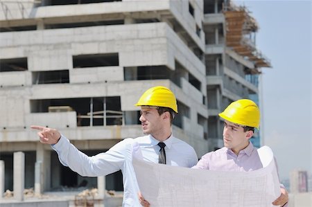 Team of business people in group, architect and engeneer  on construciton site check documents and business workflow on new building Stock Photo - Budget Royalty-Free & Subscription, Code: 400-05683618