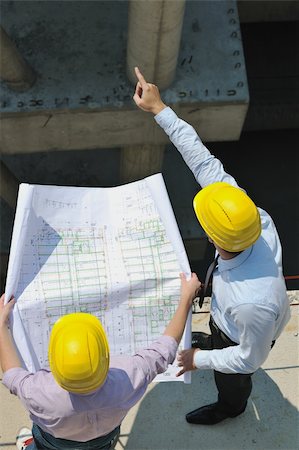 Team of business people in group, architect and engeneer  on construciton site check documents and business workflow on new building Stock Photo - Budget Royalty-Free & Subscription, Code: 400-05683619