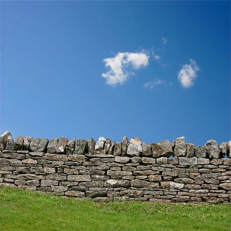 stone walls in meadows - A Stone Wall with Blue Sky and Clouds Stock Photo - Budget Royalty-Free & Subscription, Code: 400-05694027