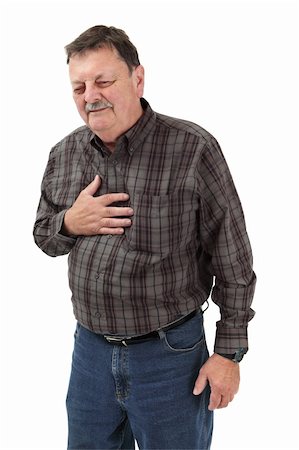 Photo of a man in his sixties suffering pain from a heart attack or severe indigestion. Stock Photo - Budget Royalty-Free & Subscription, Code: 400-05694535