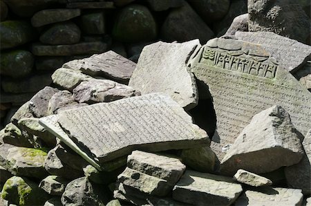 stone slab - Old broken-down stone slabs with Buddhist signs Stock Photo - Budget Royalty-Free & Subscription, Code: 400-05695803