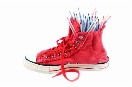 sergioua (artist) - Coloured pens in sneakers, a white background. Photographie de stock - Aubaine LD & Abonnement, Code: 400-05696350