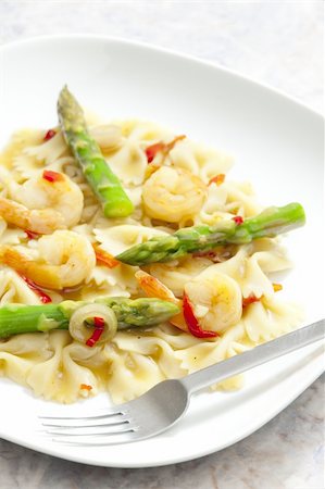 hot pasta farfalle with asparagus and prawns Stock Photo - Budget Royalty-Free & Subscription, Code: 400-05696423