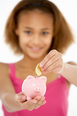 Young Girl Holding Piggy Bank Foto de stock - Super Valor sin royalties y Suscripción, Código: 400-05696543