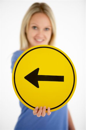 simsearch:400-05696585,k - Woman Holding Road Traffic Sign Stock Photo - Budget Royalty-Free & Subscription, Code: 400-05696558