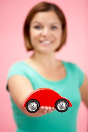 Woman Holding Toy Car Stock Photo - Budget Royalty-Free & Subscription, Code: 400-05696628