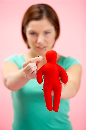 Woman Holding Voodoo Doll Foto de stock - Super Valor sin royalties y Suscripción, Código: 400-05696641