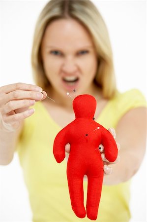 erstechen - Woman Holding Voodoo Doll Stockbilder - Microstock & Abonnement, Bildnummer: 400-05696652