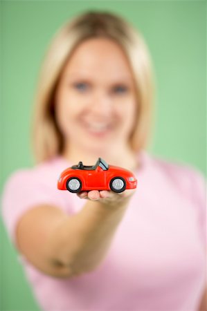 Woman Holding Toy Car Stock Photo - Budget Royalty-Free & Subscription, Code: 400-05696665