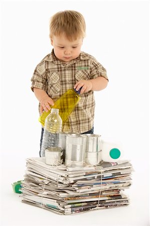 Young Boy Recycling In Studio Stock Photo - Budget Royalty-Free & Subscription, Code: 400-05696747