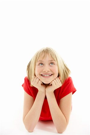 Young Girl Lying On Stomach In Studio Stock Photo - Budget Royalty-Free & Subscription, Code: 400-05697091