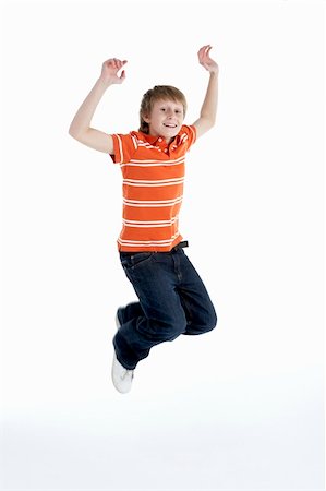 simsearch:400-04405553,k - Young Boy Jumping In Air Stock Photo - Budget Royalty-Free & Subscription, Code: 400-05697341