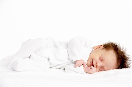 sucer son pouce - Peaceful Sleeping Newborn Baby Photographie de stock - Aubaine LD & Abonnement, Code: 400-05697412