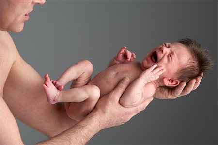 Crying Newborn Baby Held By Father Stock Photo - Budget Royalty-Free & Subscription, Code: 400-05697432