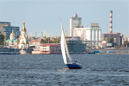 Vessel ship with white sails on water with urban scene as background. Kiev. Ukraine. Stock Photo - Budget Royalty-Free & Subscription, Code: 400-05698579