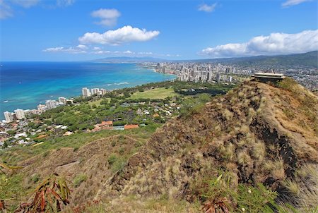 simsearch:400-06557675,k - Wide-angle view of the rim of Diamondhead Crater, Waikiki Beach and all of Honolulu in the distance from the top of the trail Foto de stock - Super Valor sin royalties y Suscripción, Código: 400-05699063
