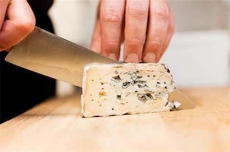 Close up of Cutting cheese Foto de stock - Super Valor sin royalties y Suscripción, Código: 400-05690097