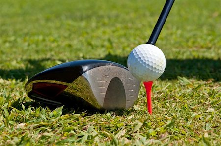 Golf ball and driver, ready to strike, on a real golf course. Stock Photo - Budget Royalty-Free & Subscription, Code: 400-05690355