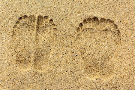 feet walking men - Two pairs of foot prints on the sand Stock Photo - Budget Royalty-Free & Subscription, Code: 400-05690478