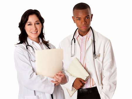 Attractive female doctor and handsome male physician medical team with white coats and stethoscopes standing holding patient file chart dossier, isolated. Stock Photo - Budget Royalty-Free & Subscription, Code: 400-05692699