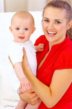 simsearch:400-05899075,k - Portrait of happy baby and smiling mommy Fotografie stock - Microstock e Abbonamento, Codice: 400-05692900