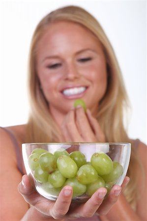 photo of model woman with grapes - Happy Healthy Young Woman Eating Healthy Food Choices Stock Photo - Budget Royalty-Free & Subscription, Code: 400-05693342