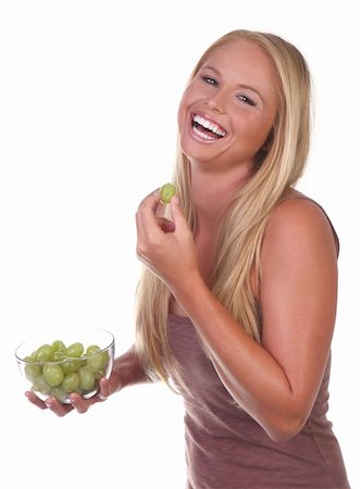 photo of model woman with grapes - Happy Healthy Young Woman Eating Healthy Food Choices Stock Photo - Budget Royalty-Free & Subscription, Code: 400-05693352