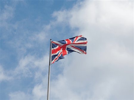 simsearch:400-06326700,k - Union Jack national flag of the United Kingdom (UK) - over blue sky background Stock Photo - Budget Royalty-Free & Subscription, Code: 400-05693568