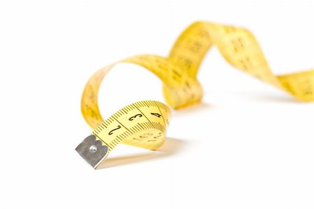 Yellow measuring tape isolated over white background Stock Photo - Budget Royalty-Free & Subscription, Code: 400-05693688