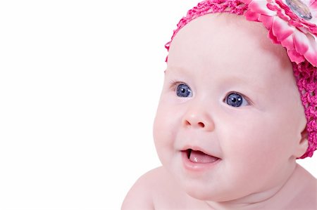 Cute beautiful little girl with pink flower on head looking up Stock Photo - Budget Royalty-Free & Subscription, Code: 400-05693692