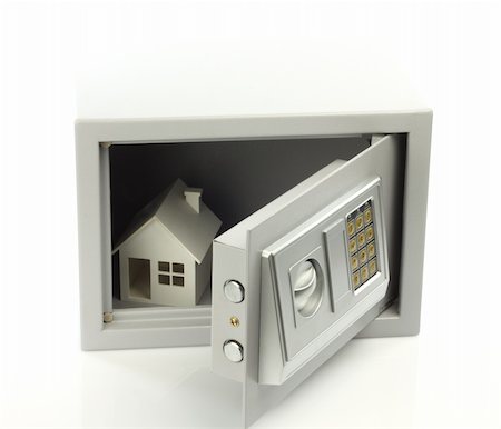 property loan - House model in safe box. Real property or insurance concept Stock Photo - Budget Royalty-Free & Subscription, Code: 400-05693726