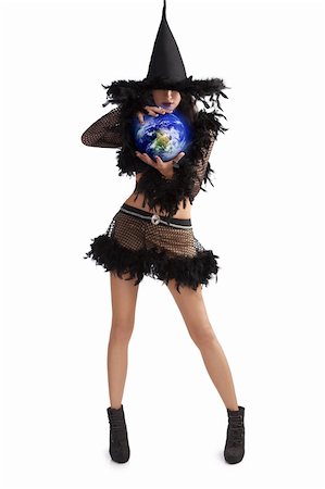 very pretty young brunette in black witch dress with hat and high heel ready for halloween holding world ball against white background Stock Photo - Budget Royalty-Free & Subscription, Code: 400-05693791